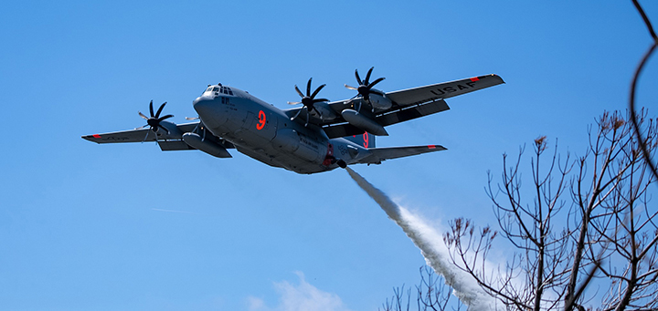 A C-130 from Nevada Air National Guard's 152nd Airlift Wing performs a water drop during Modular Airborne Firefighting System (MAFFS) training on April 14, 2023. Photo by Senior Master Sgt. Paula Macomber.