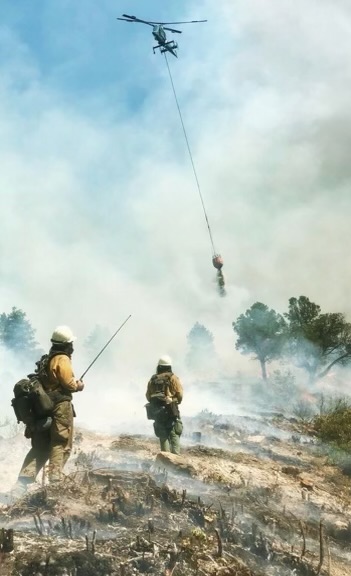 Vegas Valley Veterans crew works with helicopter on a wildfire.