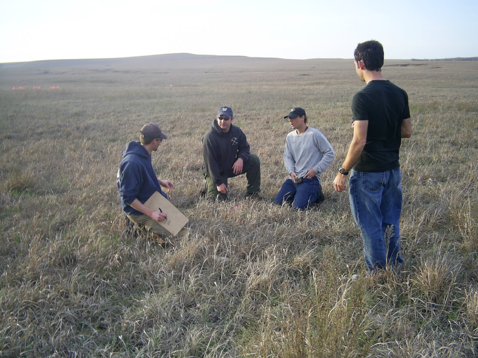 Joint Fire Science researchers discussing Big Pasture prescribed fire at Tallgrass Prairie National Preserve.